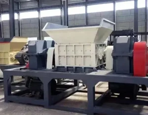 Standalone industrial waste shredder displayed on the factory floor for testing.