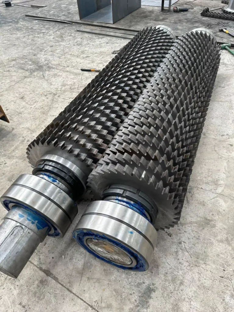 Close-up of heavy-duty double shaft shredder rotors for 2000 model, built for scrap metal recycling
